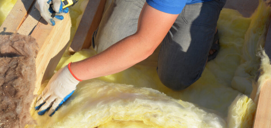 Contractor,insulating,with,mineral,wool,attic,roof.,close,up,on