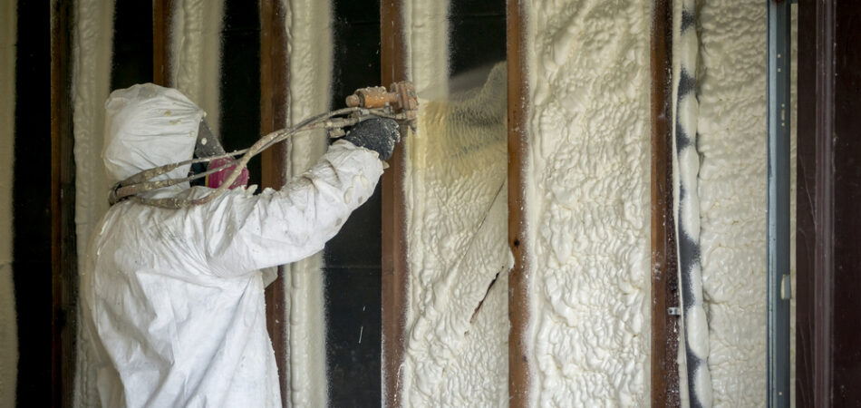 Worker,spraying,closed,cell,spray,foam,insulation,on,a,home